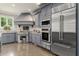 Modern kitchen featuring stainless steel appliances, custom cabinets, and granite countertops at 3 Woodlawn Ne Dr, Marietta, GA 30067