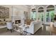 Bright living room featuring a fireplace, large windows, and stylish decor at 3 Woodlawn Ne Dr, Marietta, GA 30067