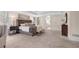 Large main bedroom featuring a tufted headboard, tray ceilings, and neutral paint at 3 Woodlawn Ne Dr, Marietta, GA 30067