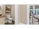 Elegant powder room located off the living room with granite countertops and hardwood flooring at 3 Woodlawn Ne Dr, Marietta, GA 30067