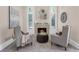 Sitting area with a cozy fireplace between two armchairs, perfect for relaxing at 3 Woodlawn Ne Dr, Marietta, GA 30067