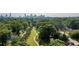 Aerial view of lush green neighborhood with tree-lined streets and glimpses of city skyline at 1008 Lena Nw St, Atlanta, GA 30314