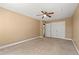 Cozy bedroom featuring carpeted floor, ceiling fan, closet, and ensuite bathroom at 1008 Lena Nw St, Atlanta, GA 30314