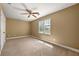 Bedroom with natural light, ceiling fan, neutral paint, and carpeted floor at 1008 Lena Nw St, Atlanta, GA 30314