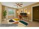 Bedroom staged with desk, monitors and modern rug, bright and inviting with virtual enhancements at 1008 Lena Nw St, Atlanta, GA 30314