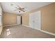 Bedroom with a ceiling fan, large closet, and neutral carpeting at 1008 Lena Nw St, Atlanta, GA 30314