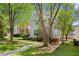Side view of a two-story home with a spacious lawn and mature trees at 1008 Lena Nw St, Atlanta, GA 30314