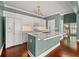 Bright kitchen features white cabinets, stainless steel appliances, and a large island with breakfast bar at 1008 Lena Nw St, Atlanta, GA 30314