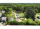 Aerial view of property showcasing its location near lush trees and a lake at 3556 Finch Sw Rd, Powder Springs, GA 30127
