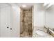 Bathroom featuring granite countertop vanity, and tiled shower at 3556 Finch Sw Rd, Powder Springs, GA 30127