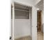 Hallway closet leading to bathroom with tiled shower at 3556 Finch Sw Rd, Powder Springs, GA 30127
