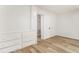 Bright bedroom with fresh paint, wood floors, and storage drawers at 3556 Finch Sw Rd, Powder Springs, GA 30127