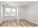 Bright bedroom featuring fresh paint, wood floors and natural light from the window at 3556 Finch Sw Rd, Powder Springs, GA 30127
