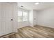 Bright bedroom featuring fresh paint, wood floors and natural light from the window at 3556 Finch Sw Rd, Powder Springs, GA 30127