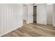 View into a bedroom featuring wood-look floors, fresh paint and closet at 3556 Finch Sw Rd, Powder Springs, GA 30127