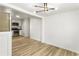 Dining area featuring modern lighting, new flooring, and kitchen access at 3556 Finch Sw Rd, Powder Springs, GA 30127