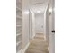 Hallway with built-in shelves, fresh paint, and wood-look floors at 3556 Finch Sw Rd, Powder Springs, GA 30127