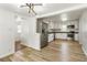 Bright kitchen and dining area featuring stainless steel appliances, stone countertops, and white cabinets at 3556 Finch Sw Rd, Powder Springs, GA 30127