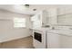 Laundry room with two windows and updated washer and dryer at 3556 Finch Sw Rd, Powder Springs, GA 30127
