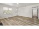 Bright living room featuring wood-look floors, natural light, and neutral wall color at 3556 Finch Sw Rd, Powder Springs, GA 30127