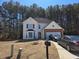 A two-story home boasting light siding, dark shutters, and a well-manicured front yard and driveway at 3578 Willow Spring Ct, Decatur, GA 30034