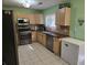 Fully equipped kitchen offers ample counter space, wooden cabinets, and stainless steel appliances at 3578 Willow Spring Ct, Decatur, GA 30034