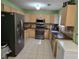 Well-lit kitchen features wooden cabinets, granite countertops, and stainless steel appliances at 3578 Willow Spring Ct, Decatur, GA 30034