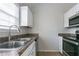 Functional kitchen featuring stainless steel appliances, double basin sink and white cabinets at 3721 Longview Dr, Douglasville, GA 30135