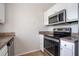 Clean kitchen equipped with stainless steel appliances and light-colored countertops at 3721 Longview Dr, Douglasville, GA 30135