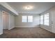 An open-concept living room with two windows that bring in natural light at 3721 Longview Dr, Douglasville, GA 30135