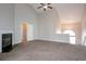 Open-concept living room with high ceilings, fireplace and plush carpet at 3721 Longview Dr, Douglasville, GA 30135