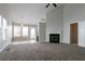 Spacious living room with carpet flooring, a fireplace, and a ceiling fan at 3721 Longview Dr, Douglasville, GA 30135