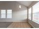 Open-concept living room with tiled dining area, high ceilings and large windows at 3721 Longview Dr, Douglasville, GA 30135