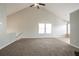 Large living room featuring high ceilings, plush carpeting and a ceiling fan at 3721 Longview Dr, Douglasville, GA 30135