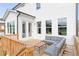 A wooden deck featuring a gray sectional and offering an outdoor space for relaxation at 417 Newland Way, Acworth, GA 30102