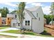 Two-story home with white siding, well-manicured lawn, and a paved driveway at 417 Newland Way, Acworth, GA 30102
