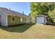 Exterior of home showing spacious backyard and detached garage at 6895 Brown S Dr, Fairburn, GA 30213