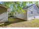 Home's exterior showing the detached garage and yard at 6895 Brown S Dr, Fairburn, GA 30213