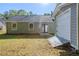 View of the home's backyard and detached garage at 6895 Brown S Dr, Fairburn, GA 30213