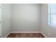 A bedroom featuring neutral walls, carpet flooring, and a window that brings in ample natural light at 6895 Brown S Dr, Fairburn, GA 30213