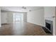 Inviting living room with hardwood floors, a fireplace, and a bay window offering ample natural light at 6895 Brown S Dr, Fairburn, GA 30213
