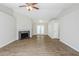 Large living room featuring hardwood floors, a fireplace, and French doors to a back patio at 6895 Brown S Dr, Fairburn, GA 30213