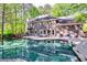 Expansive backyard featuring a pristine swimming pool and outdoor seating at 7635 Blandford Pl, Atlanta, GA 30350
