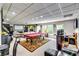 Finished basement featuring a pool table, bar, and media area for entertaining guests and relaxation at 7635 Blandford Pl, Atlanta, GA 30350