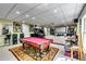Finished basement with pool table, arcade games and entertainment area for endless fun and relaxation at 7635 Blandford Pl, Atlanta, GA 30350