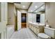 Bathroom features a double vanity sink, toilet, and shower with a bathtub at 7635 Blandford Pl, Atlanta, GA 30350