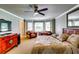 Comfortable bedroom with ceiling fan and cozy seating area next to the window at 7635 Blandford Pl, Atlanta, GA 30350