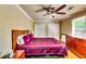 Bedroom with a ceiling fan, a chest of drawers, and two closets at 7635 Blandford Pl, Atlanta, GA 30350