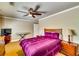 Bedroom with a ceiling fan, a flat-screen TV, a piano, and a chest of drawers at 7635 Blandford Pl, Atlanta, GA 30350