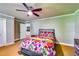 Bedroom features carpet flooring, ceiling fan, and large windows at 7635 Blandford Pl, Atlanta, GA 30350